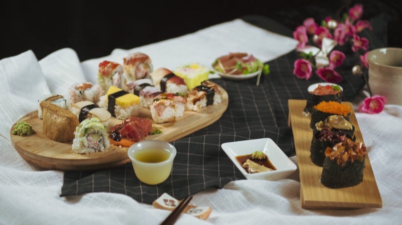 Tomi Sushi and Seafood Buffet dining spread with fresh sushi and seafood